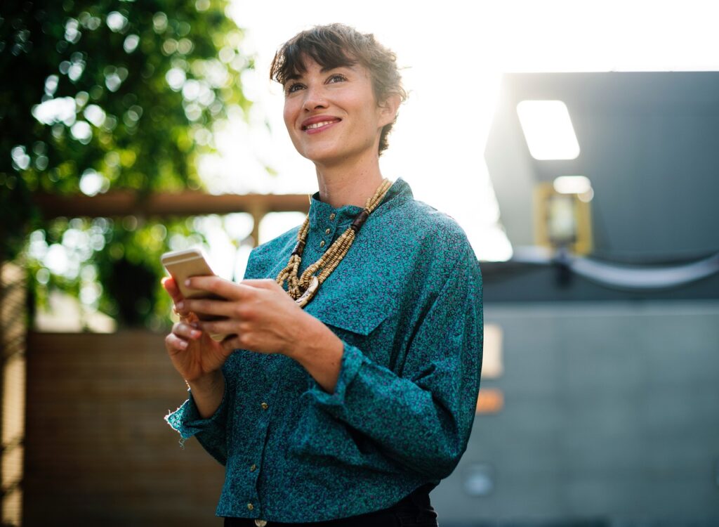 Business professionals using SMS marketing on mobile devices